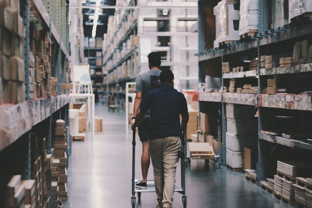 two men in a warehouse